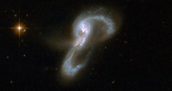 The colliding galaxy pair VV705. Astronomers have measured a set of merging galaxies to determine the relative contributions to luminosity from star formation versus from accretion around the supermassive black hole nucleus. For VV705, they find that nearly 75% of the luminosity comes from star formation. NASA/Hubble